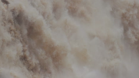 Close-up-water-rushing-down-waterfall-at-Barron-Falls-in-Cairns,-Australia