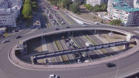 Tilting-4k-aerial-shot-of-Roundabout-and-highway-near-Arena-and-Genex