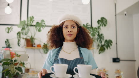 waitress in a cafe with a tray of coffee