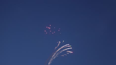 Acrobatic-pyrotechnical-aircrafts-releasing-flares-and-fireworks-during-their-display