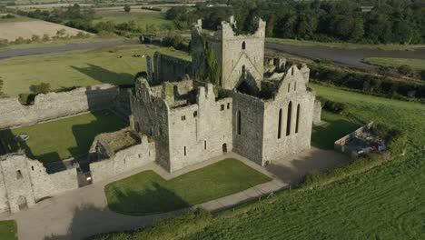 Aerial-view,-pan-left,-Dunbrody-Abbey-is-a-former-Cistercian-monastery-in-County-Wexford,-Ireland