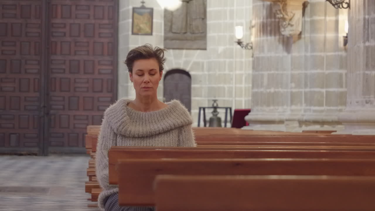 Beautiful Mature Woman Sits in Empty Church