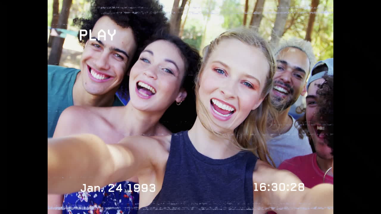 Taking selfie outdoors, group of friends with vintage video animation overlay