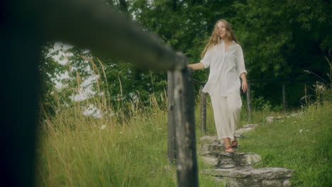 smiling woman walking path