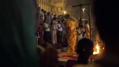 prayer and worship at nighttime ceremony in varanasi