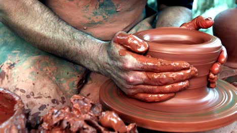 medieval potter using potters wheel and hands crafting earthenworks clay molds porcelains ceramics producing cooking pots, storage containers decorative objects guild member medieval craft ocupation