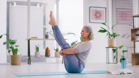 Senior-woman-doing-yoga-on-a-mat-in-a-modern