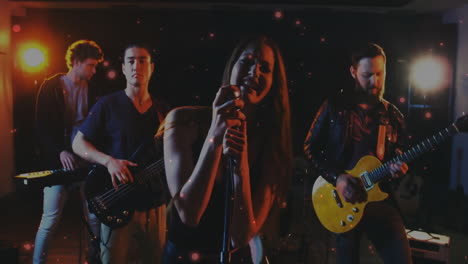 music industry band performing on dimly lit stage, with spotlights glowing and particles floating