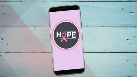 animación del logotipo de la cinta rosa del cáncer de mama con texto de esperanza en la pantalla del teléfono inteligente