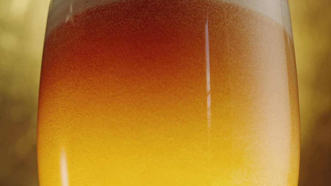 Close up of a glass of beer with foam