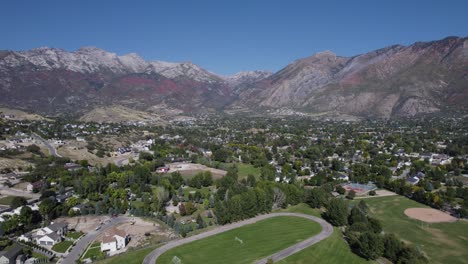 aerial view of urban downtown alpine city among mountain range, utah