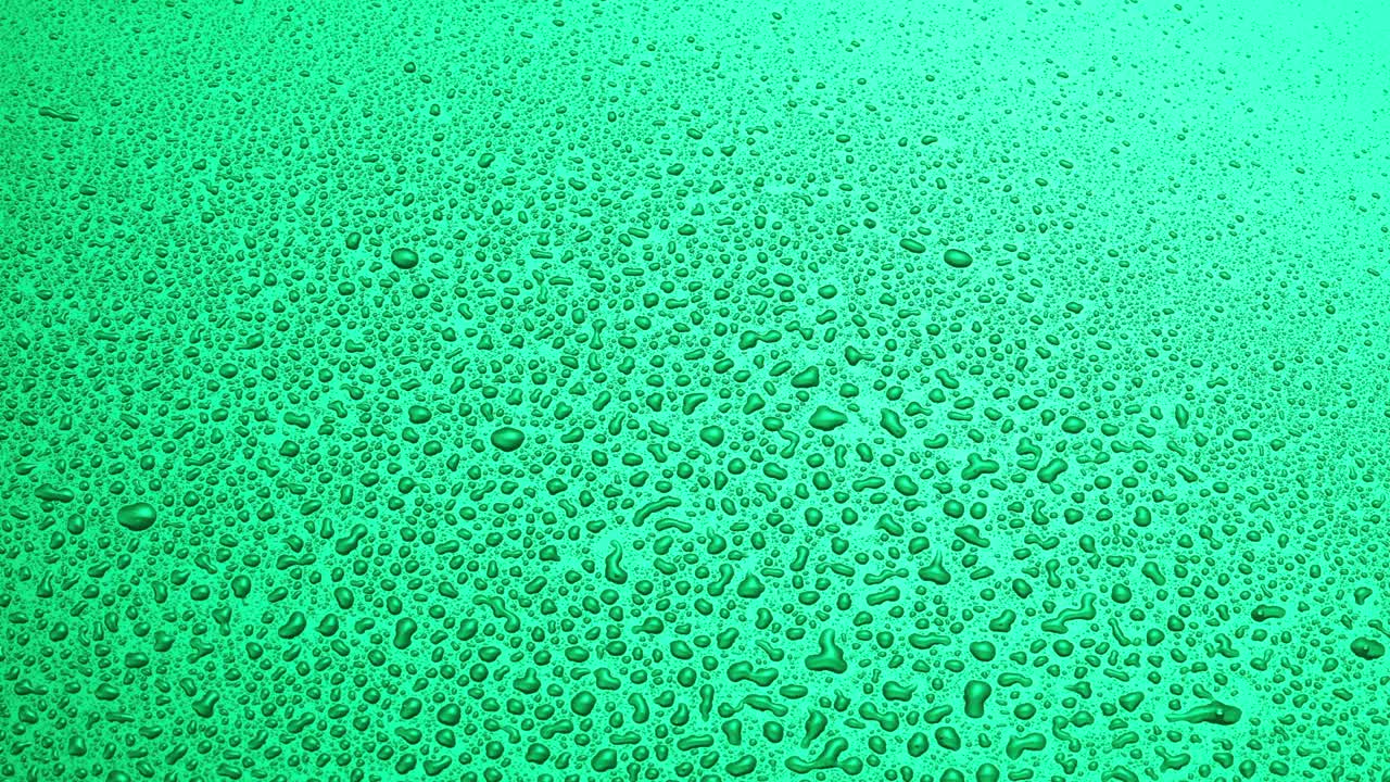 물방울을 뿌리는 추상적인 녹색 배경