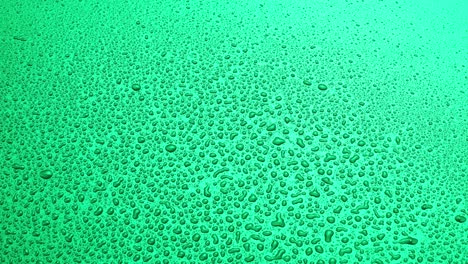 fondo de color verde abstracto con gotas de agua rociadas