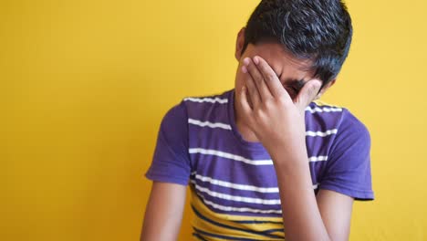 Young-man-frustrated-and-suffering-headache,-close-up