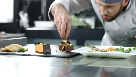 chef decorating cake at kitchen. closeup chef making dessert in slow motion.