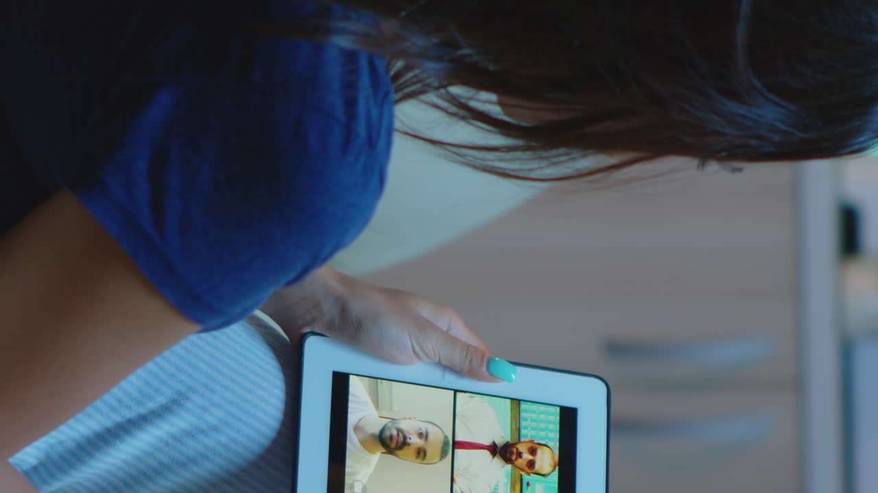 Vertical Video: Freelancer Using Tablet For Video Conference