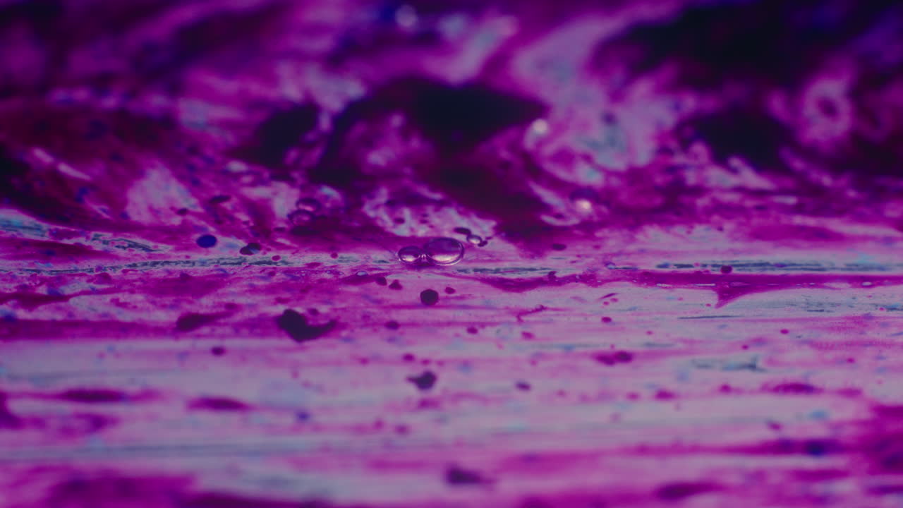 Colourful, organic, liquids macro shots buzzing and flowing