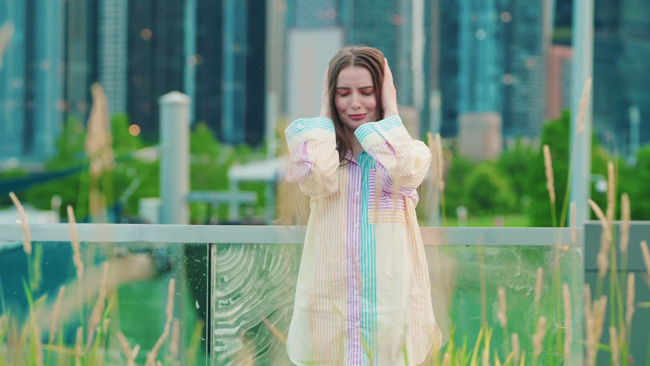 pretty anxious girl covers ears with palms and shakes head as &amp;quot;I dont want to hear this&amp;quot; reaction