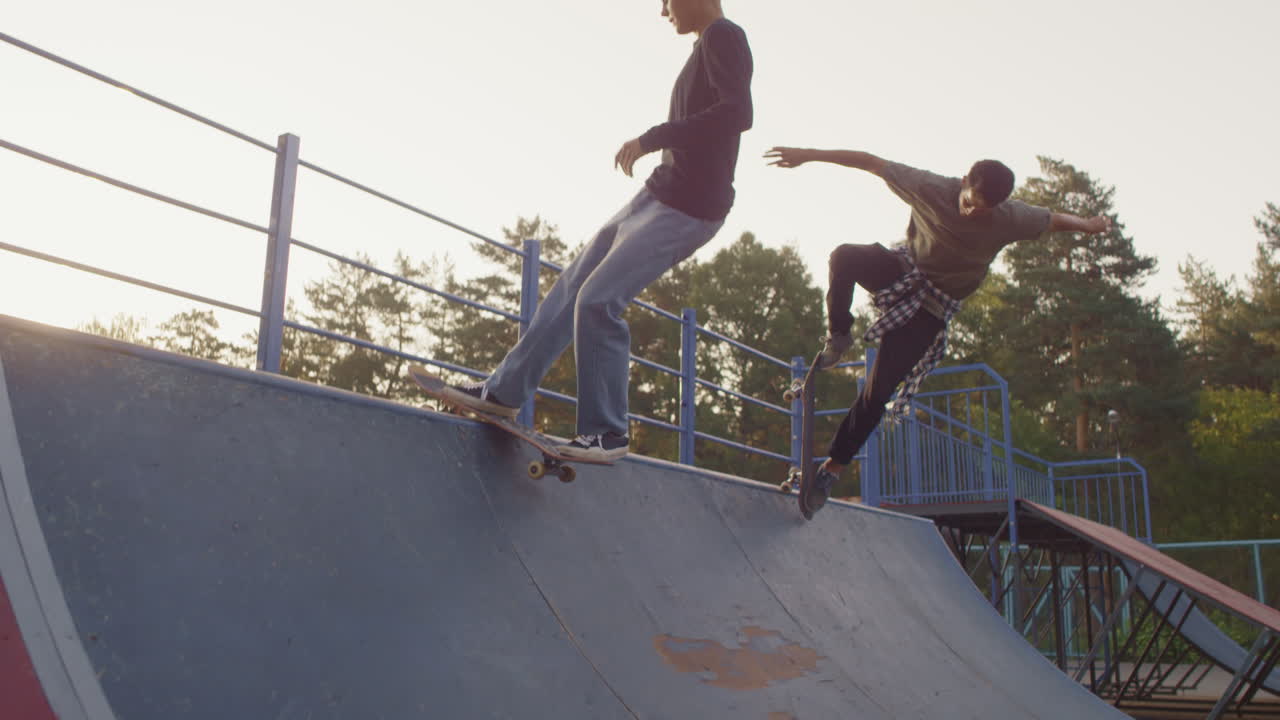Teenagers Skating on Ramp