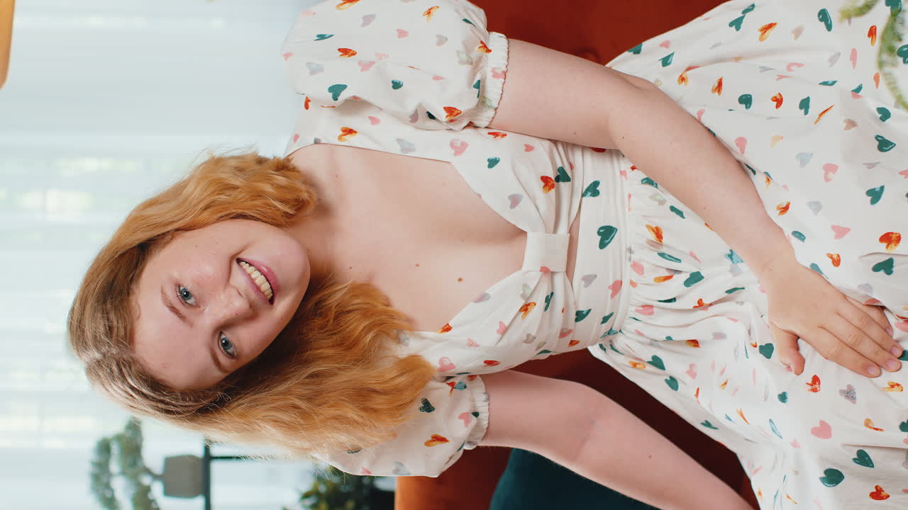 Pretty young woman smiling pointing to camera choosing lucky winner indicating inviting approve