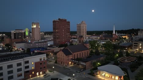 Jackson,-Michigan-downtown-at-night-with-drone-video-close-up-low-moving-in