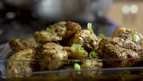 Garnishing-Green-Chopped-Onion-Rings-Over-Chicken-Dish