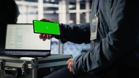 data center worker uses isolated screen smartphone while deploying deep learning