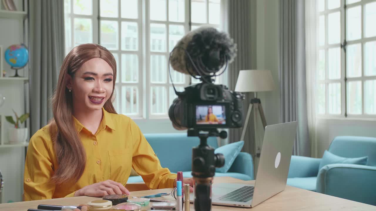 Influencer Young Transgender Woman Blogger Read Comment On Laptop Computer. Transgender Woman Recording Video Blog Tells How To Be Beautiful In Home Studio