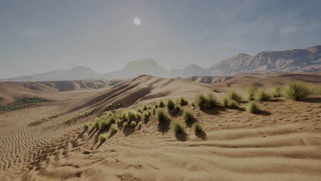 a desert landscape with sand dunes, mountains, and a bright sun in the sky