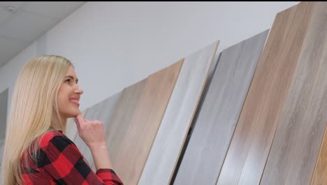 a young woman is delving into various clothing options while exploring a stylish retail shopping environment
