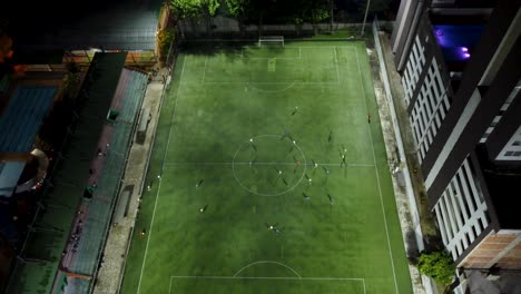 aerial view of a soccer field in the middle of a friendly match