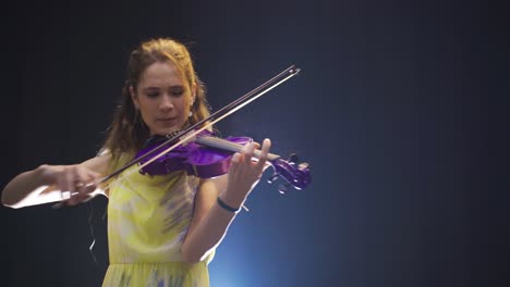 talented violinist young woman playing the violin. music spirit.