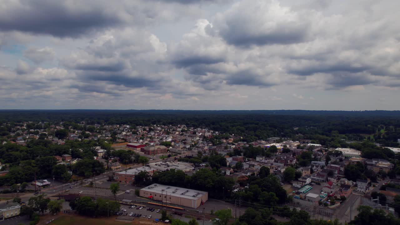 A high angle, aerial drone shot over the suburban neighborhood of Glen Cove on Long Island, NY on a cloudy day