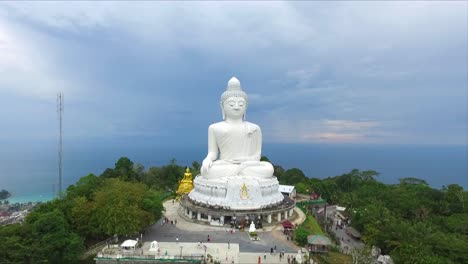 zoom out of big buddha statue in phuket, thailand