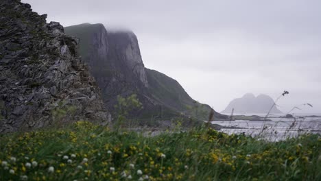 Timelapse-in-Værøy,-Norway-displaying-clouds-playing-along-the-mountains