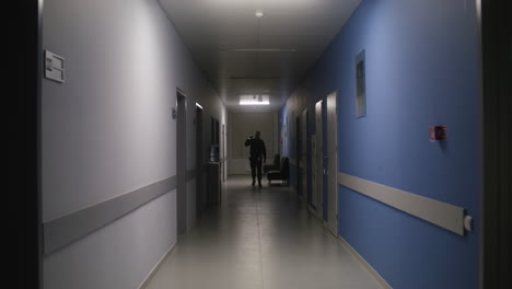 Man-in-uniform-working-on-the-corridor