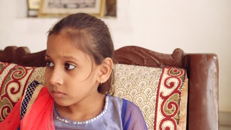 portrait of an indian child at home during coronavirus lockdown