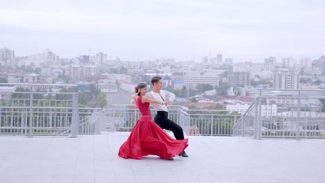 couple dancing ballroom on rooftop