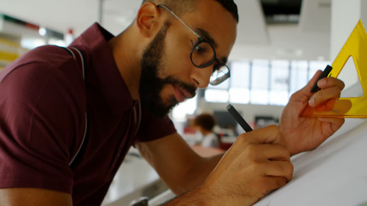 Male architect working in office 4k