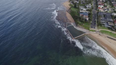 Ocean-Rockpool-At-The-Southern-End-Of-Collaroy-Beach-In-Sydney,-Australia---aerial-drone-shot