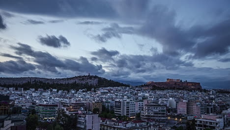 timelapse shot of cloud movement over city surrounding acropolis of athens in greece on a cloudy evening