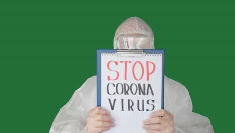 Man wearing protective suit showing clipboard with inscription
