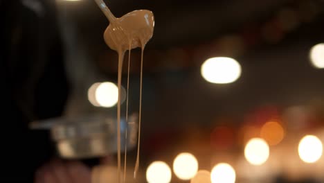 Delicious-chocolate-sauce-dripping-from-the-ladle-in-slow-motion