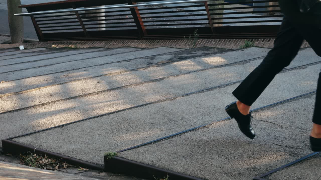 Man in suit walking on stairs
