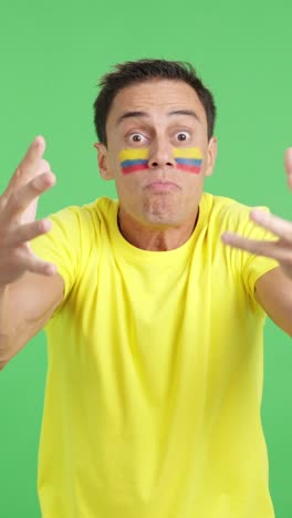 man cheering for colombia, angry with the decision of referee