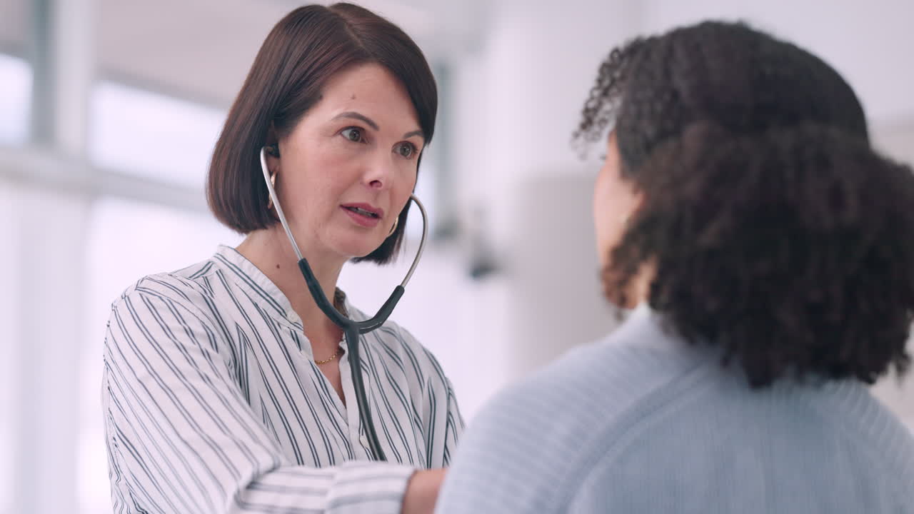 Consultation, doctor and women with stethoscope
