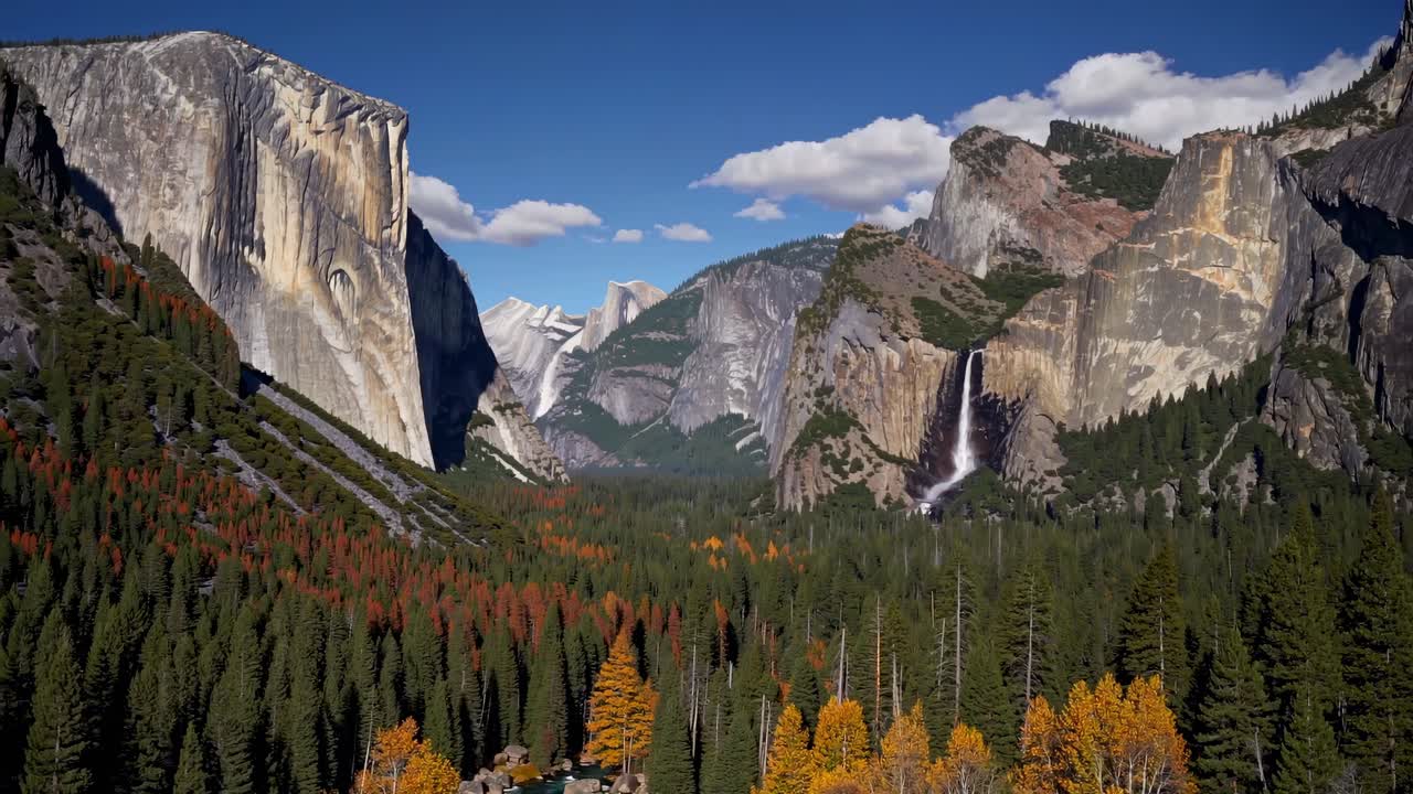 Aerial video captures majestic mountains and lush forest in autumn
