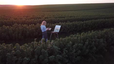 a professional artist paints a picture