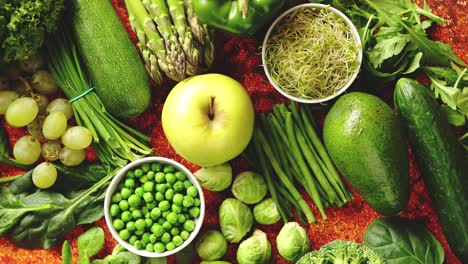 Fresh-green-vegetables-and-fruits-assortment-placed-on-a-rusty-metal