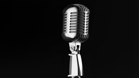 vintage chrome microphone on black background
